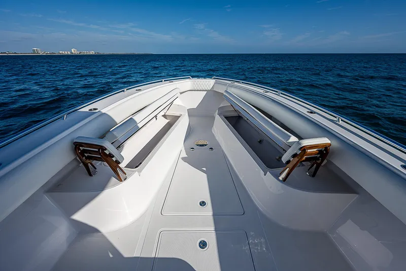 T/t Waterfront Yacht Photos Pics 2013 Bahama Quad V10's boat deck with ocean view under clear blue sky.