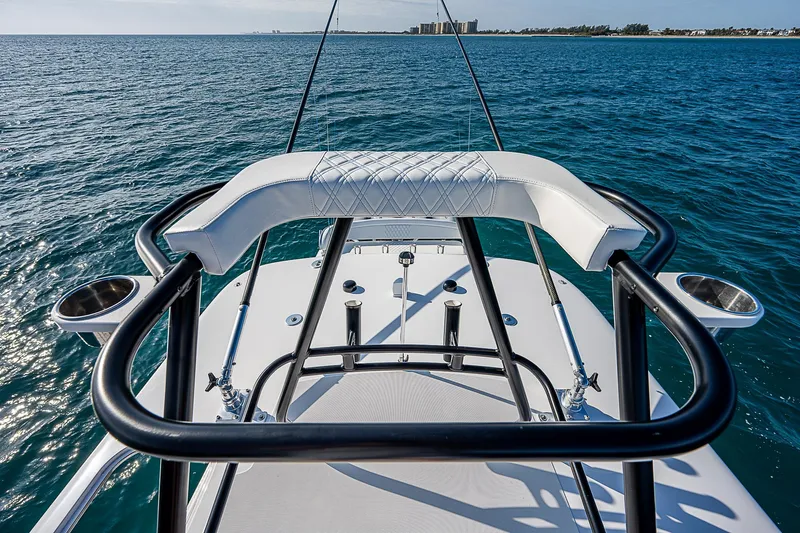 T/t Waterfront Yacht Photos Pics 2013 Bahama Quad V10's boat with sleek design on open water.