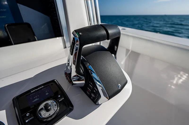 T/t Waterfront Yacht Photos Pics Boat throttle controls on a 2013 Bahama Quad V10's, ocean in background.