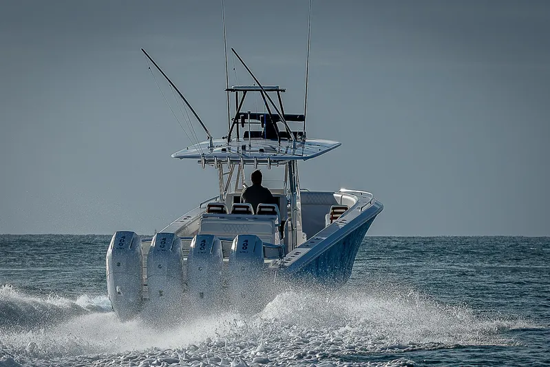 T/t Waterfront Yacht Photos Pics Bahama Quad V10's 2013 boat cruising on open water with four engines.