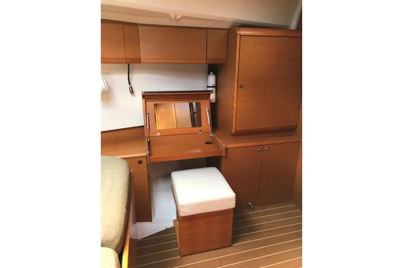 Northern Lights Yacht Photos Pics Interior of 2015 Jeanneau Sun Odyssey 469 yacht with wooden cabinetry and seating.