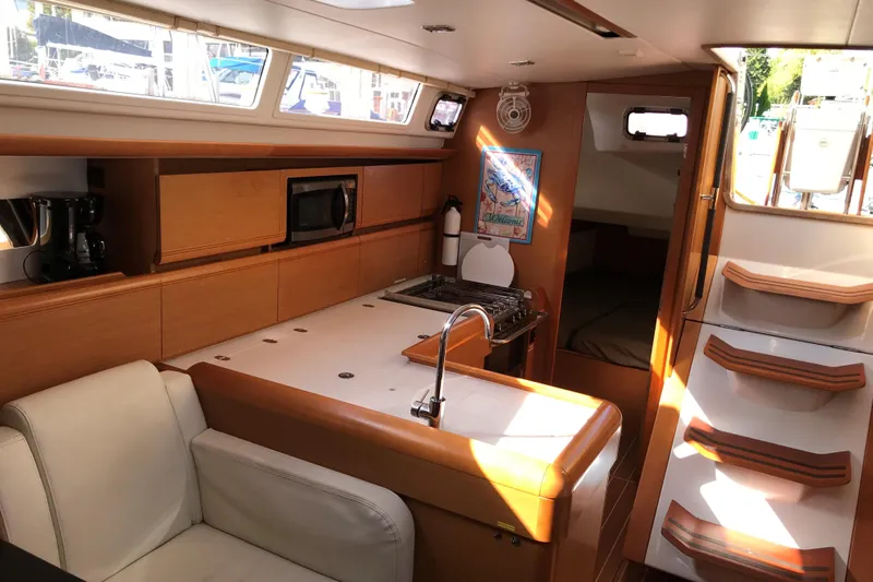 Northern Lights Yacht Photos Pics Interior of 2015 Jeanneau Sun Odyssey 469 yacht with modern kitchen and seating area.