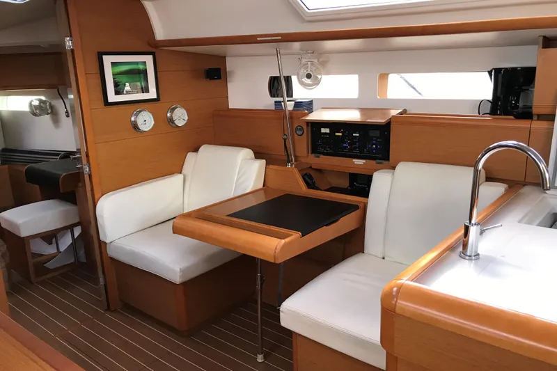 Northern Lights Yacht Photos Pics Interior of 2015 Jeanneau Sun Odyssey 469 yacht with modern seating and navigation panel.