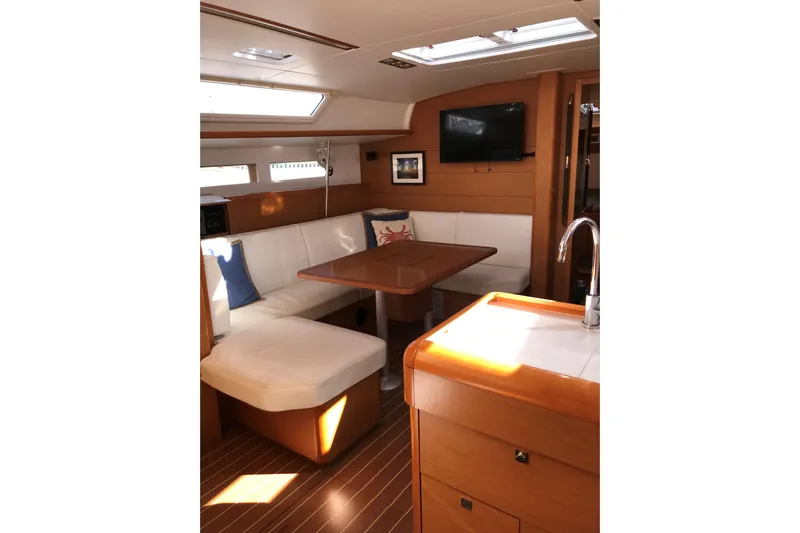 Northern Lights Yacht Photos Pics Interior of 2015 Jeanneau Sun Odyssey 469 yacht with cozy seating and modern amenities.