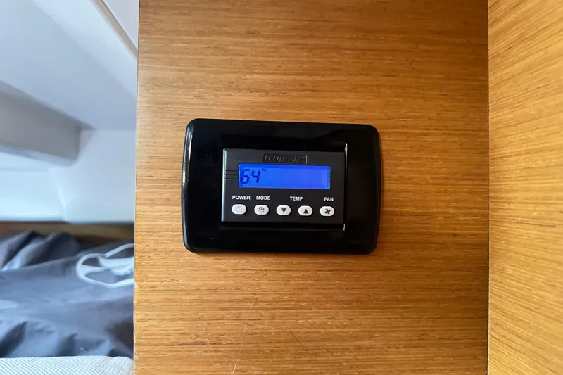 Northern Lights Yacht Photos Pics Thermostat on 2015 Jeanneau Sun Odyssey 469 yacht, displaying 64 degrees.