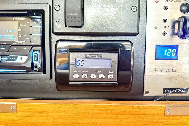 Northern Lights Yacht Photos Pics Control panel of a 2015 Jeanneau Sun Odyssey 469 yacht, displaying temperature and settings.