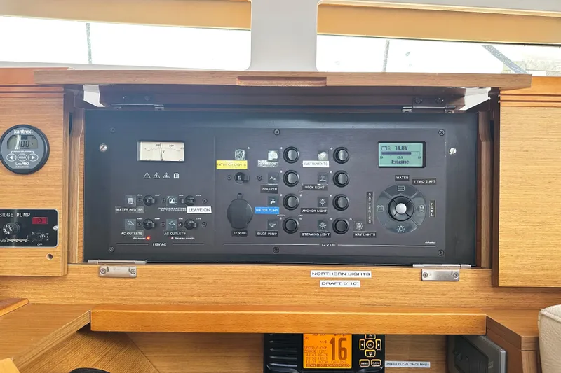 Northern Lights Yacht Photos Pics Control panel of 2015 Jeanneau Sun Odyssey 469 yacht, featuring various switches and gauges.