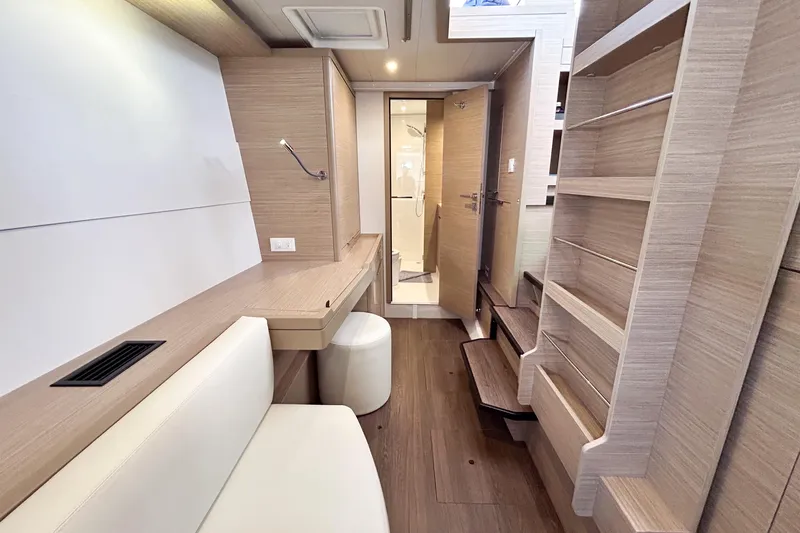 Oasis Yacht Photos Pics Modern interior of 2025 Lagoon 40 yacht with wooden finishes and sleek design.