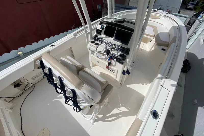  Yacht Photos Pics 2018 Robalo R242 Center Console boat interior with helm and seating.