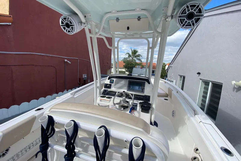  Yacht Photos Pics 2018 Robalo R242 Center Console boat interior with steering wheel and electronics.