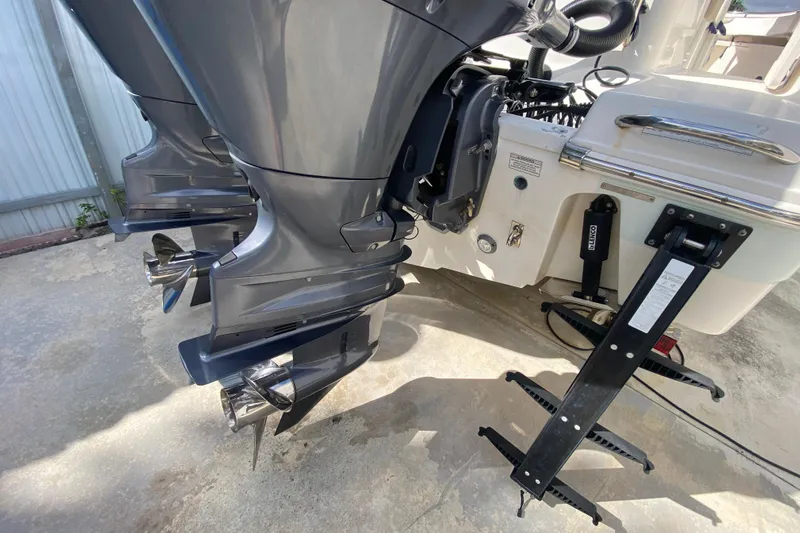  Yacht Photos Pics 2018 Robalo R242 Center Console boat with dual outboard motors and propellers.