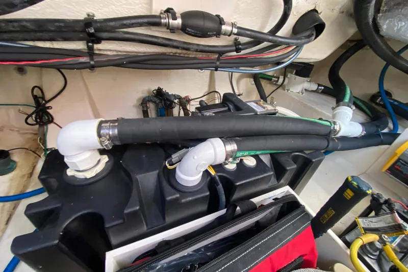  Yacht Photos Pics 2018 Robalo R242 Center Console boat engine compartment with hoses and wiring.