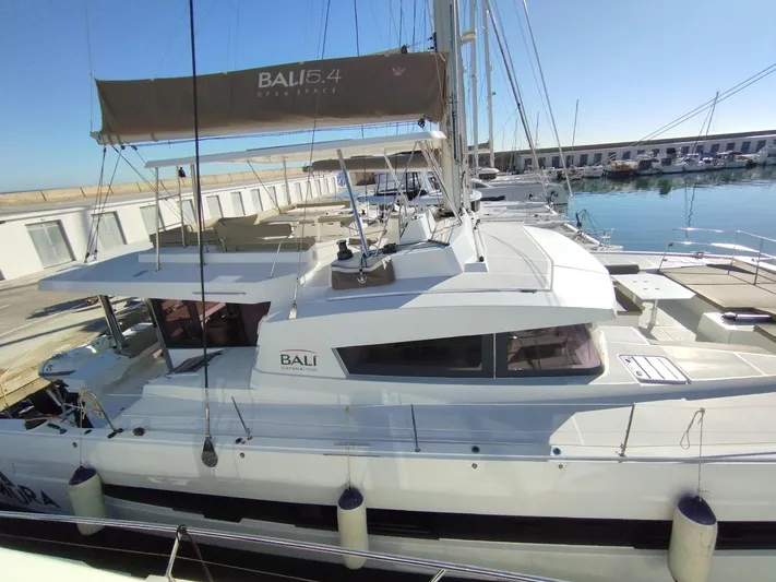Amura Yacht Photos Pics Bali 5.4 catamaran docked at marina, 2021 model, sunny day.