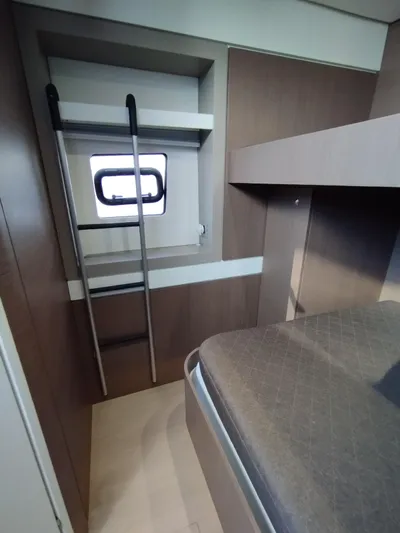 Amura Yacht Photos Pics Interior of 2021 Bali 5.4 yacht cabin with ladder and window.