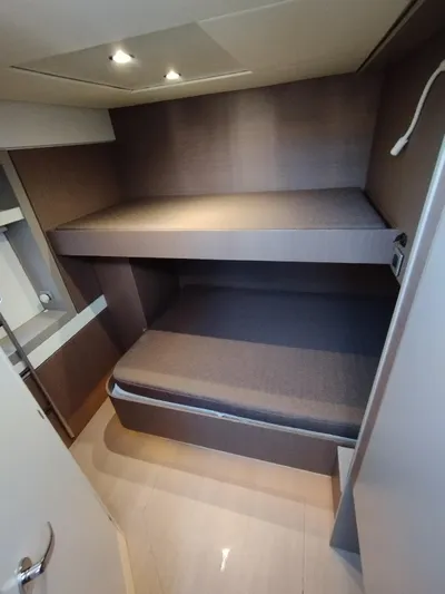 Amura Yacht Photos Pics 2021 Bali 5.4 yacht interior with modern bunk beds and sleek design.