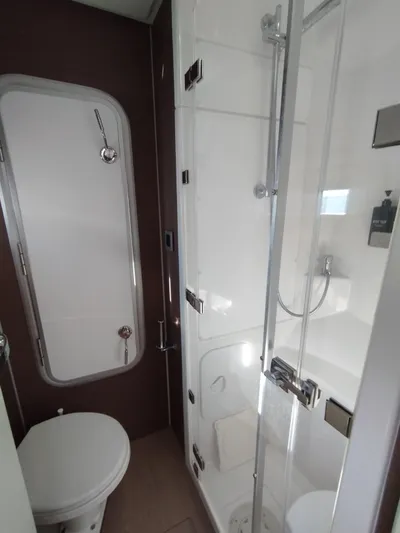Amura Yacht Photos Pics Compact modern bathroom in a 2021 Bali 5.4 model yacht, featuring a shower and toilet.