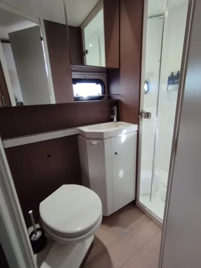 Amura Yacht Photos Pics Compact bathroom in 2021 Bali 5.4, featuring modern fixtures and a sleek shower.