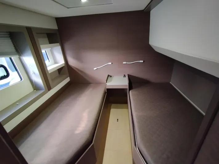 Amura Yacht Photos Pics Modern cabin interior of 2021 Bali 5.4 yacht with twin beds and window.