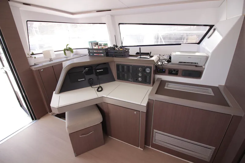 Amura Yacht Photos Pics Modern interior of 2021 Bali 5.4 yacht with navigation controls and sleek design.