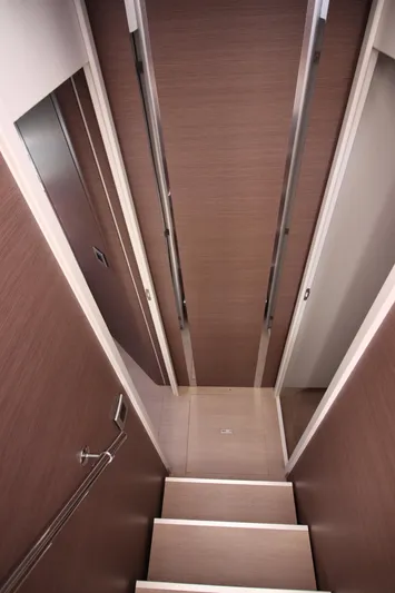 Amura Yacht Photos Pics Staircase in 2021 Bali 5.4 yacht, featuring sleek wooden design and modern finishes.