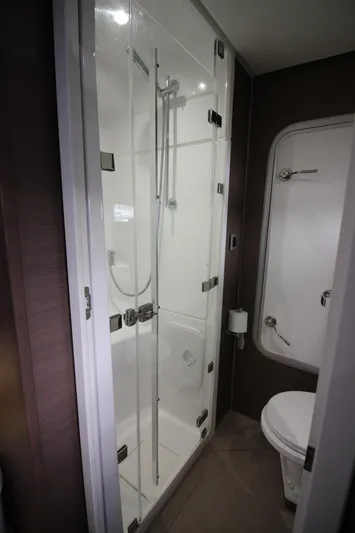 Amura Yacht Photos Pics Compact bathroom in a 2021 Bali 5.4 model, featuring a glass shower and toilet.