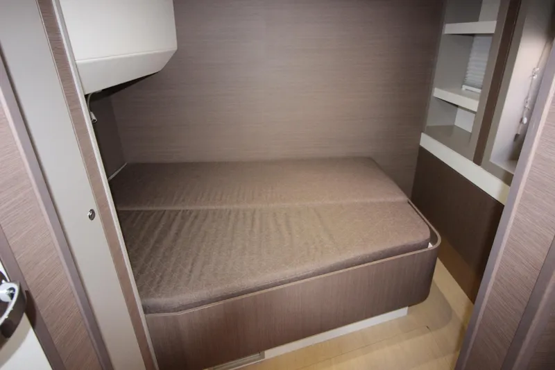 Amura Yacht Photos Pics Compact cabin interior of a 2021 Bali 5.4 yacht with a cozy bed.