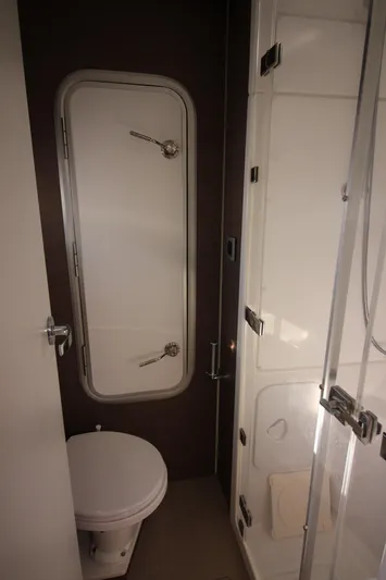 Amura Yacht Photos Pics Compact bathroom in a 2021 Bali 5.4 model, featuring a toilet and shower.