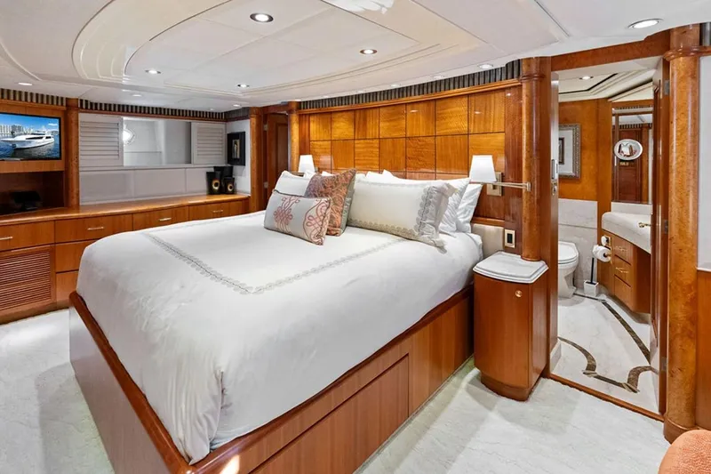 Picosa Lady Yacht Photos Pics Luxurious 2001 West Bay Sonship yacht bedroom with elegant wood finishes and en-suite bathroom.
