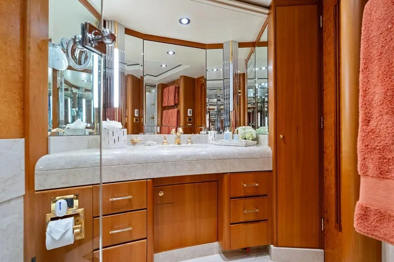 Picosa Lady Yacht Photos Pics Luxurious bathroom in 2001 West Bay Sonship yacht with wood cabinetry and elegant fixtures.