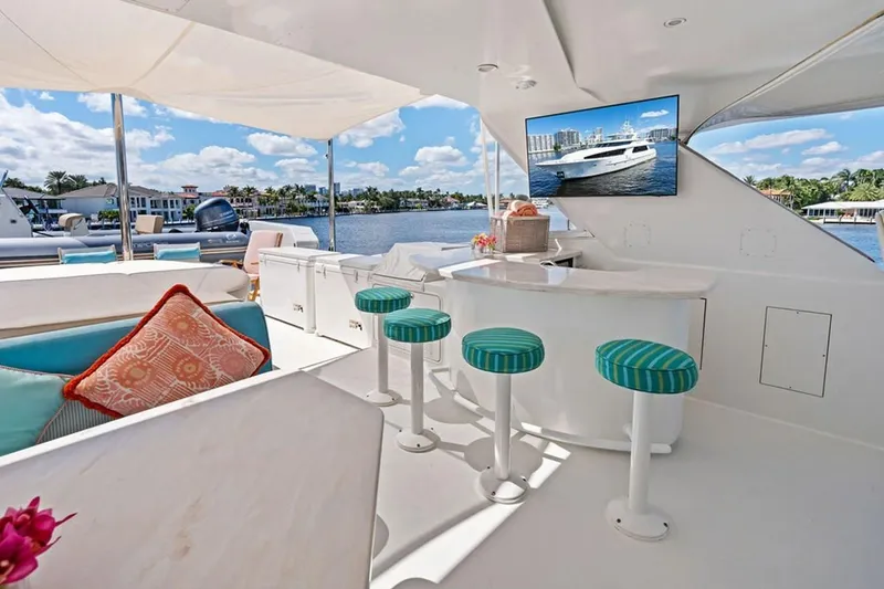 Picosa Lady Yacht Photos Pics Luxurious 2001 West Bay Sonship yacht interior with bar stools and waterfront view.