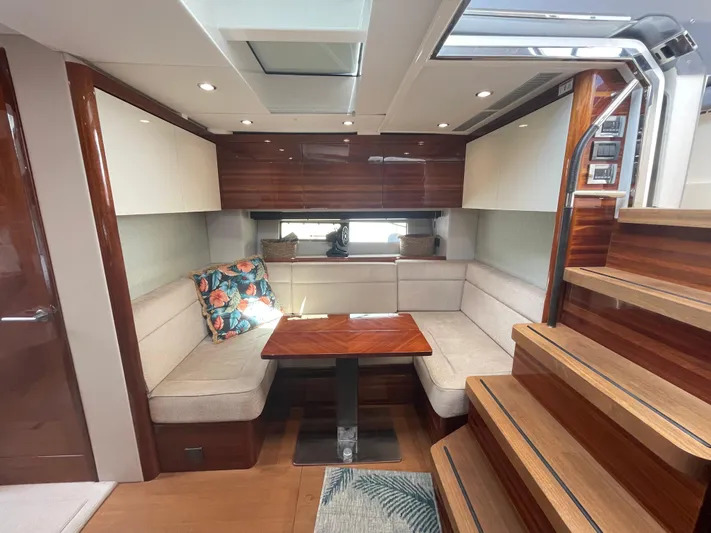 Ohana Yacht Photos Pics Luxurious 2013 Sealine S450 yacht interior with elegant seating and wooden finishes.