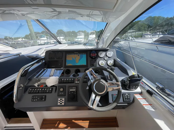 Ohana Yacht Photos Pics 2013 Sealine S450 yacht helm with navigation controls and steering wheel.