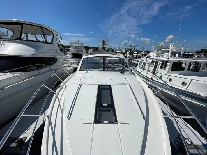 Ohana Yacht Photos Pics 2013 Sealine S450 yacht docked at marina under clear blue sky.