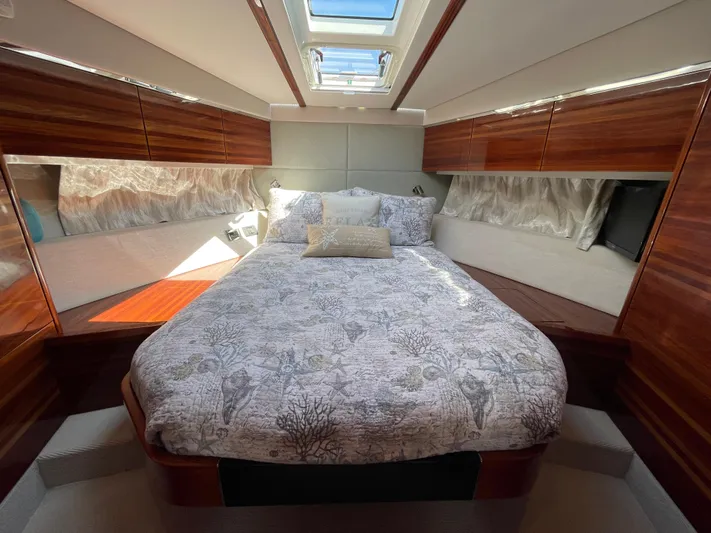 Ohana Yacht Photos Pics Luxurious cabin interior of 2013 Sealine S450 yacht with elegant bedding and wood finishes.