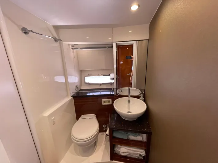 Ohana Yacht Photos Pics Bathroom interior of 2013 Sealine S450 yacht with modern fixtures and elegant design.