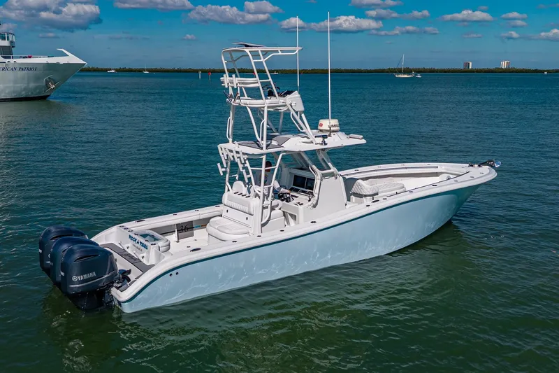 Rock N Reel Yacht Photos Pics 2018 Yellowfin 36 Offshore boat on calm water, featuring dual Yamaha engines.