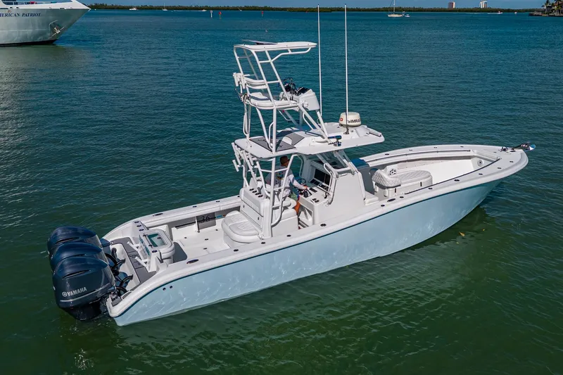 Rock N Reel Yacht Photos Pics 2018 Yellowfin 36 Offshore boat on calm water with triple Yamaha engines.