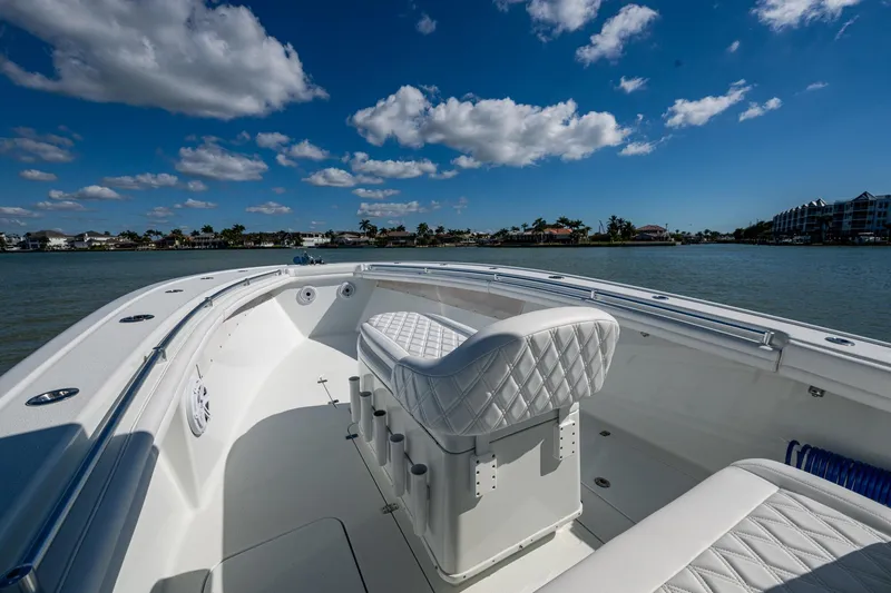 Rock N Reel Yacht Photos Pics 2018 Yellowfin 36 Offshore boat with white seating, cruising on a sunny day.
