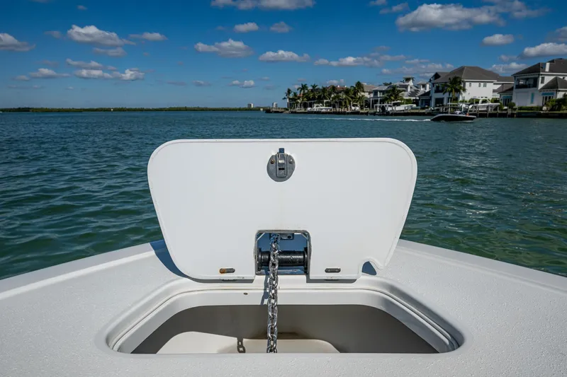 Rock N Reel Yacht Photos Pics 2018 Yellowfin 36 Offshore boat with open anchor hatch, scenic waterfront view.