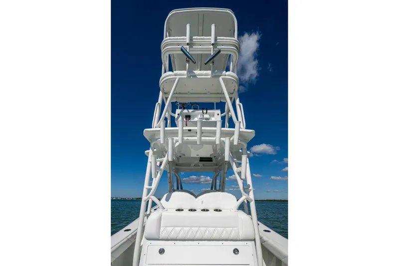 Rock N Reel Yacht Photos Pics 2018 Yellowfin 36 Offshore boat with tower against clear blue sky.