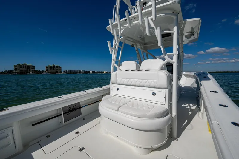 Rock N Reel Yacht Photos Pics 2018 Yellowfin 36 Offshore boat on water, featuring white seating and clear blue sky.