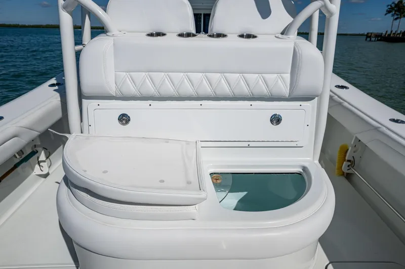 Rock N Reel Yacht Photos Pics 2018 Yellowfin 36 Offshore boat interior with white seating and storage compartment.