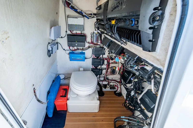 Rock N Reel Yacht Photos Pics 2018 Yellowfin 36 Offshore boat interior with toilet and electrical systems.