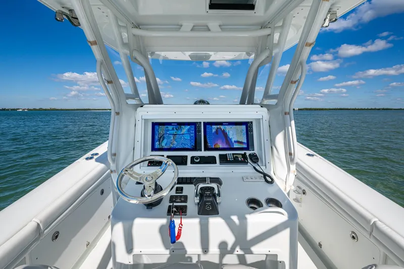 Rock N Reel Yacht Photos Pics 2018 Yellowfin 36 Offshore boat helm with dual navigation screens on open water.