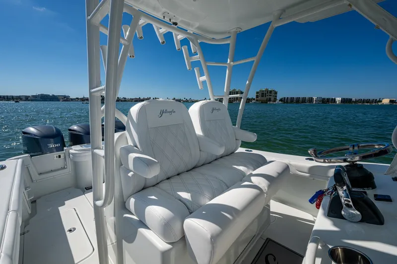 Rock N Reel Yacht Photos Pics 2018 Yellowfin 36 Offshore boat interior with white seating and ocean view.