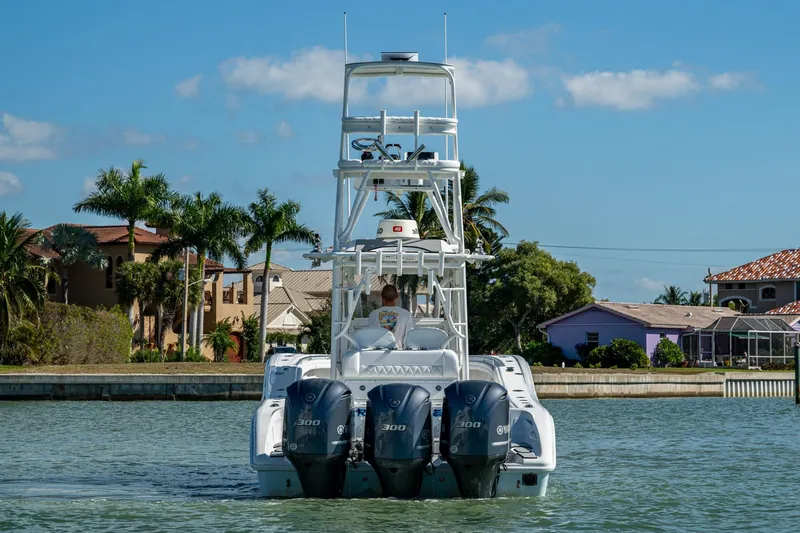 Rock N Reel Yacht Photos Pics 2018 Yellowfin 36 Offshore boat with triple engines on a sunny day.