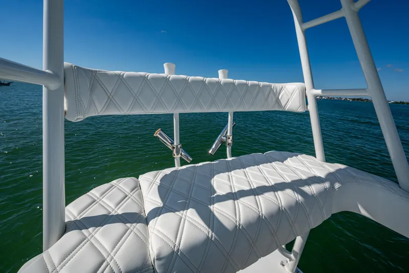 Rock N Reel Yacht Photos Pics 2018 Yellowfin 36 Offshore boat with white cushioned seating, ocean view.