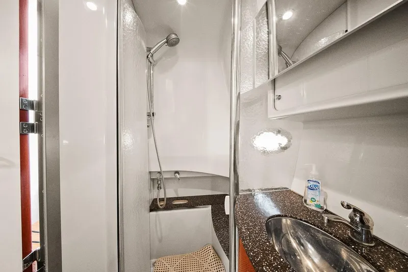 Pura Vida Yacht Photos Pics 2008 Formula 40 Performance Cruiser bathroom with shower, sink, and modern fixtures.