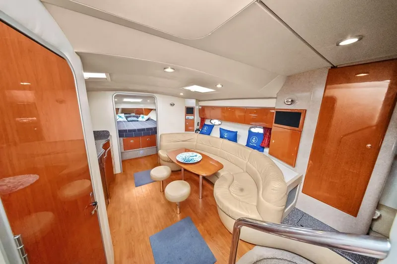Pura Vida Yacht Photos Pics Luxurious interior of a 2008 Formula 40 Performance Cruiser with elegant seating and modern amenities.