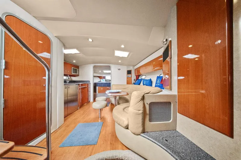 Pura Vida Yacht Photos Pics Luxurious interior of a 2008 Formula 40 Performance Cruiser with modern amenities and wood finishes.